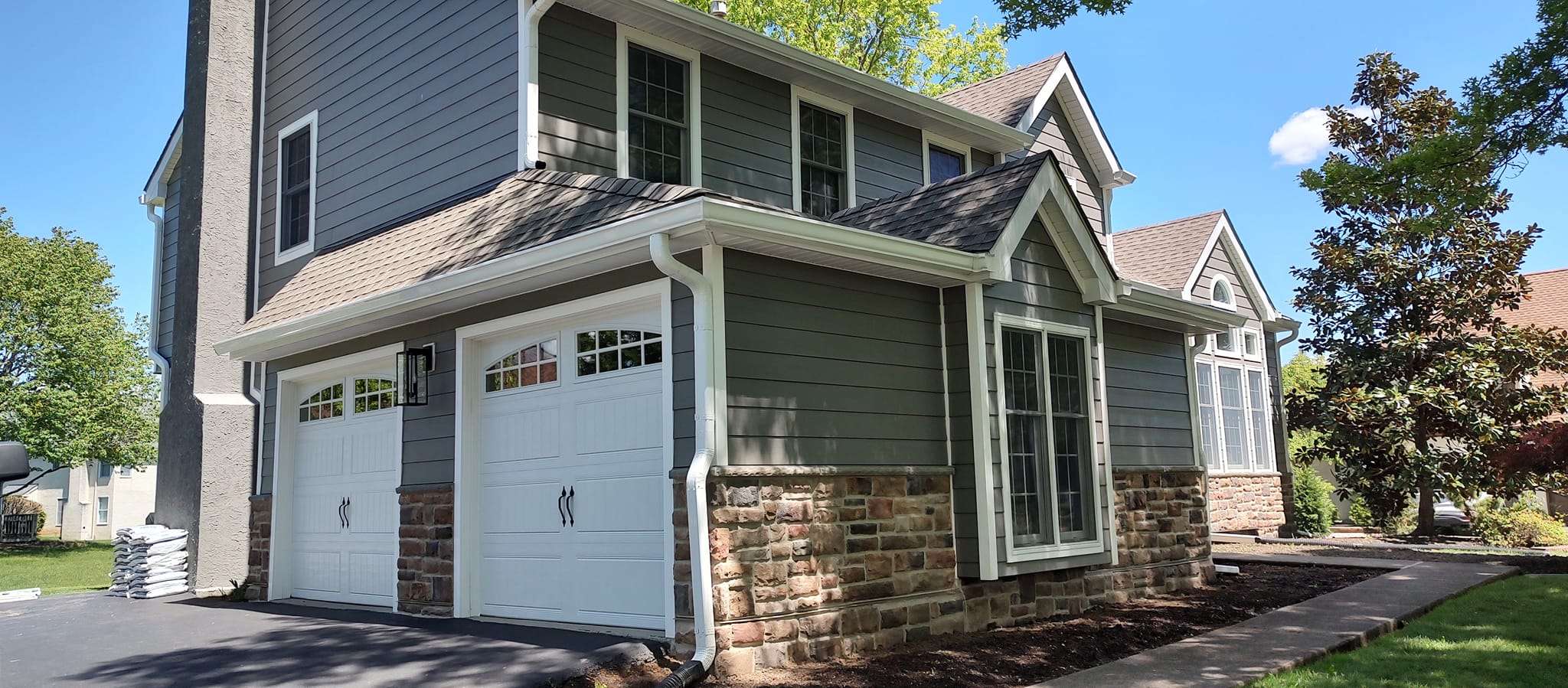 New seamless gutter system installed by KPI Jr Exteriors after hail dented the previous gutters