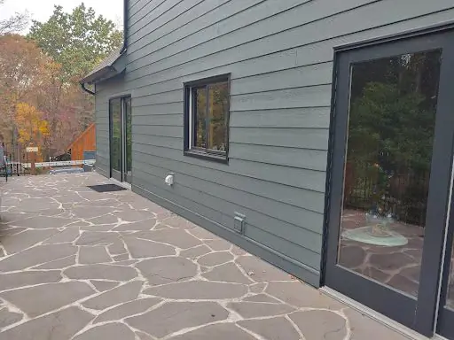 Finished vinyl siding installation with clean trim, soffit and fascia detailing on a Bucks County home