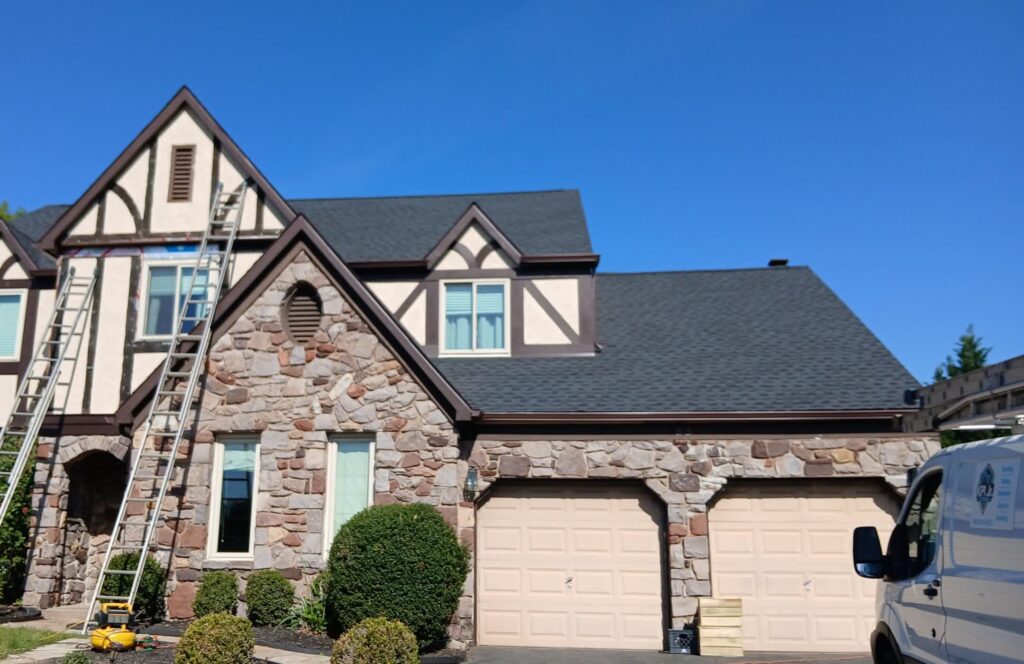 Two-storey Bucks County home with a new dark asphalt shingle roof installed by KPI Jr Exteriors