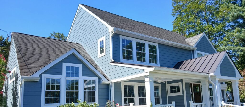 Colonial home with blue lap siding, white trim and a covered front porch